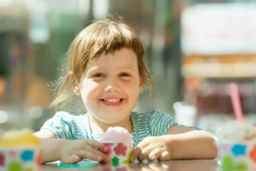 Happy 3 years baby girl eating ice cream