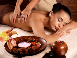 Obraz na płótnie Canvas Woman having massage in the spa salon