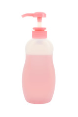 Plastic bottle dispenser pump with liquid on white background.