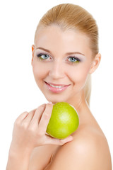 Bright spring portrait of happy healthy woman holding apple