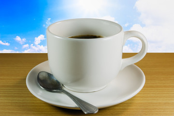 Coffee cup on wooden table