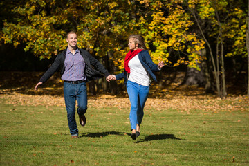 Healthy lifestyle - woman and man running in park