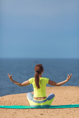 Fototapeta na wymiar Woman yoga. Series. Outdoor. On the seashore