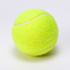 tennis ball isolated on a grey background