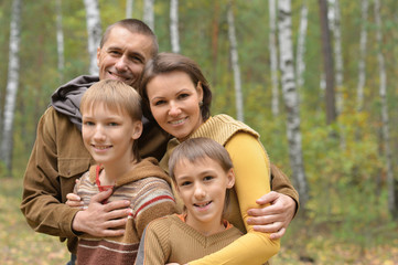 Happy family in the autumn park