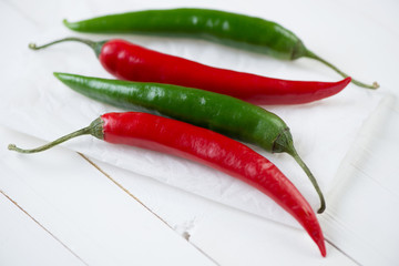 Close-up of red and green chili peppers, horizontal shot