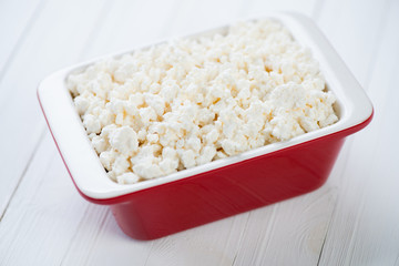 Cottage cheese in a glass dish, close-up