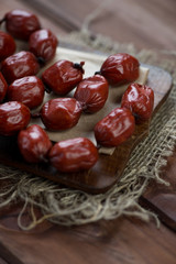 Close-up of smoked mini sausages, vertical shot