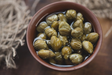 Above view of marinated capers, horizontal shot