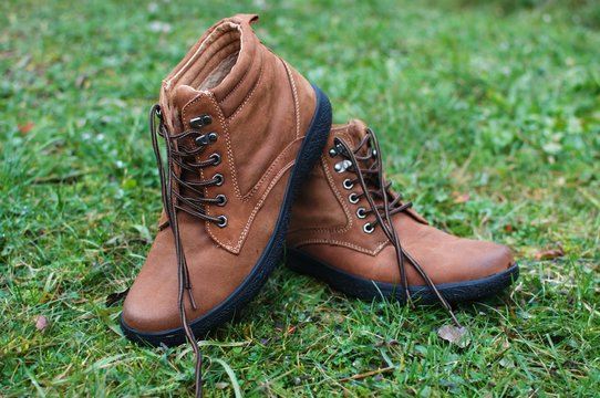 Brown leather boots in the grass