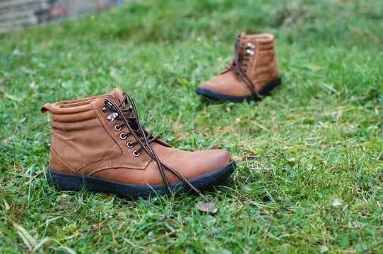 Brown leather boots in the grass