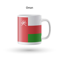 Oman flag souvenir mug on white background.