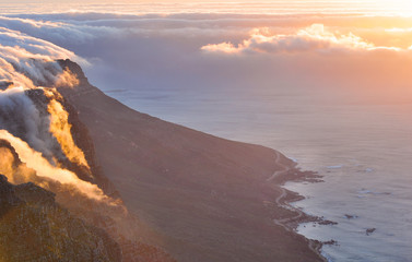 Top of Table Mountain in Cape Town covered in clouds, sunset