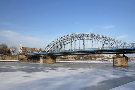 frozen Vistula river and bridge in Krakow, Poland