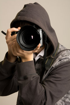 Portrait of male photographer with camera