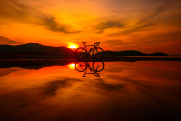 Silhouette bicycle with reflection