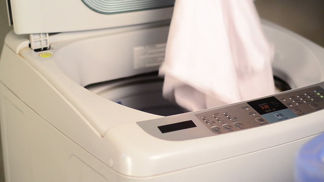 Apply clothes into washing machine