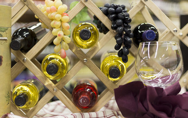 Bottles of Wine and Grapes