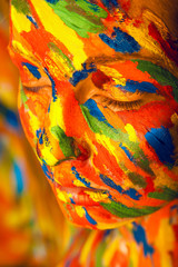 woman in colourful paint on skin