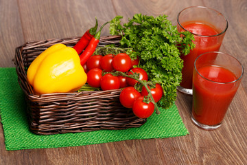 Basket with veggies and tomato juice