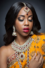 Indian woman in traditional clothing with bridal makeup