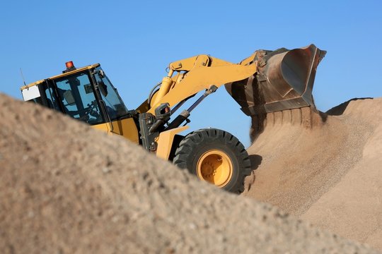 Bulldozer Working with Sand