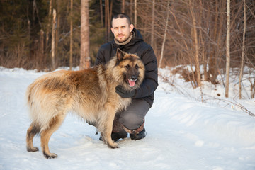 Belgian shepherd with his owner