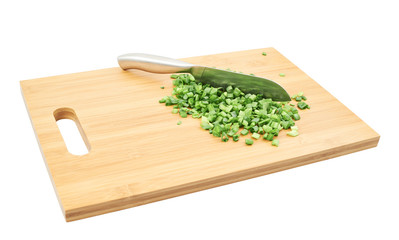 Cut in pieces green onion over cutting board