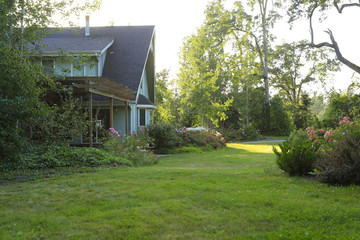 Fototapeta na wymiar Farmhouse with beautiful flowerbed