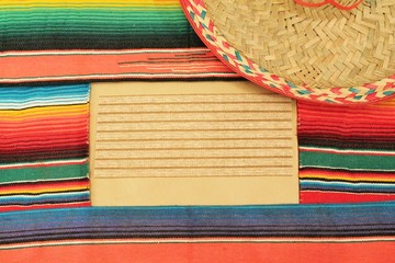 Mexican sombrero poncho with sombrero cinco de mayo background mexico fiesta copy space pattern stripes copy space stock photo photograph picture image