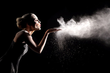 Woman With Stop Motion of Explosive Powder Captured by Flash