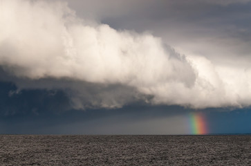 Naklejka na ściany i meble Rainbow over the sea.