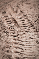 Close up  trace of a tyre in the sand
