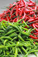 Green chili and red chili on the market.