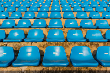 Naklejka premium The empty blue stadium seat.