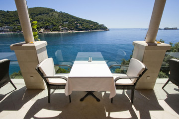 Table for two with sea view on restaurant terrace