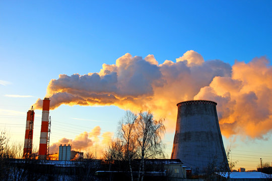 Factory chimneys smoke rising into the sky