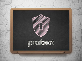Privacy concept: Shield With Keyhole and Protect on chalkboard