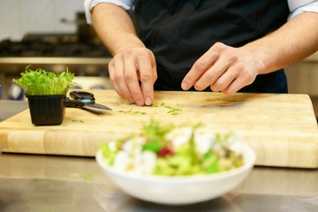 Chief cook preparing salad