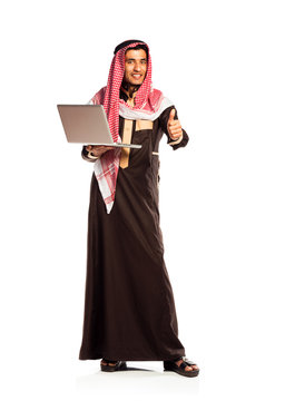Young smiling arab with laptop isolated on white