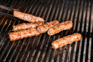 Cevapcici - minced meat - on a grill