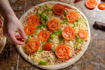 Chef making pizza at kitchen