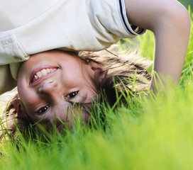 Group of happy children playing outdoors in spring park