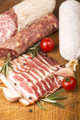 Smoked sausage with rosemary and peppercorns tomatoes and garlic