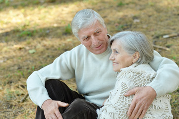 Elderly couple in autumn park
