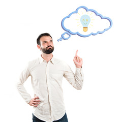Young man having an idea over white background