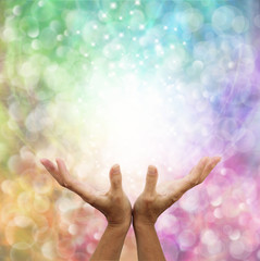 Rainbow healing energy on bokeh background