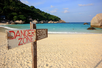 Sign of danger on the beach, Nangyuan island, Thailand