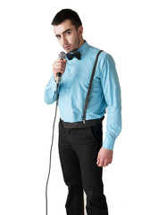 Gallant man holding a microphone - isolated on white background.