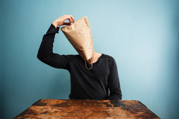 confused man with bag over head - obrazy, fototapety, plakaty